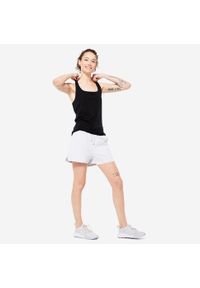 DOMYOS - Koszulka bez rękawów damska Domyos Gym & Pilates slim. Kolor: czarny. Materiał: materiał, bawełna, lyocell, elastan. Długość rękawa: bez rękawów. Sport: joga i pilates