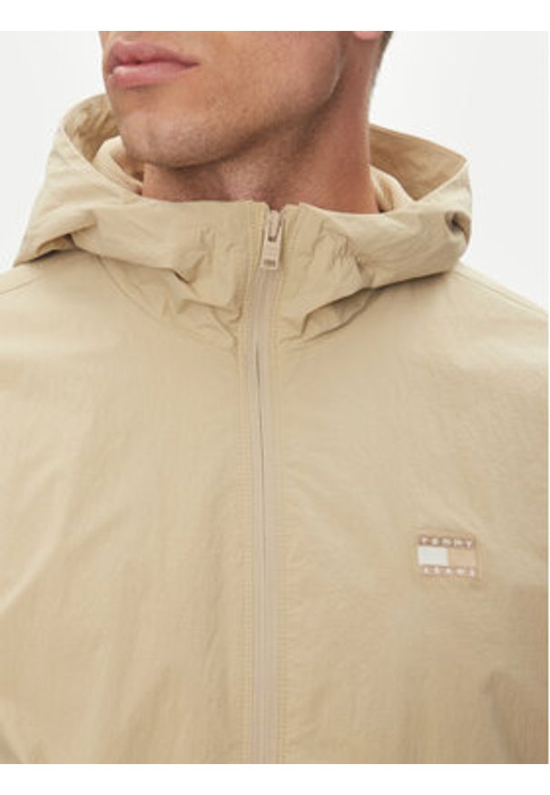 Tommy Jeans Wiatrówka Chicago DM0DM21393 Beżowy Regular Fit. Kolor: beżowy. Materiał: syntetyk