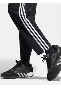 Adidas - adidas Spodnie dresowe Train Essentials HZ5646 Czarny Loose Fit. Kolor: czarny. Materiał: syntetyk #5