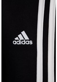 Adidas - adidas Szorty dziecięce kolor czarny z aplikacją. Kolor: czarny. Wzór: aplikacja