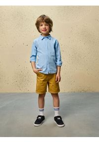 Sinsay - Szorty jeansowe z podwijanymi nogawkami - żółty. Kolor: żółty. Materiał: jeans