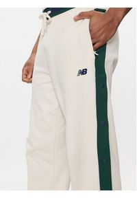 New Balance Spodnie dresowe Greatest Hits MP41504 Beżowy Regular Fit. Kolor: beżowy. Materiał: bawełna #3