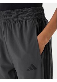 Adidas - adidas Spodnie dresowe Train Essentials 3-Stripes Woven KC5496 Czarny Regular Fit. Kolor: czarny. Materiał: syntetyk #3