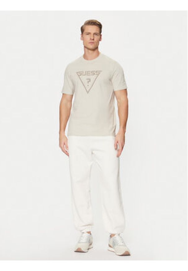 Guess Spodnie dresowe Z4YB00 KAIJ1 Écru Relaxed Fit. Materiał: bawełna