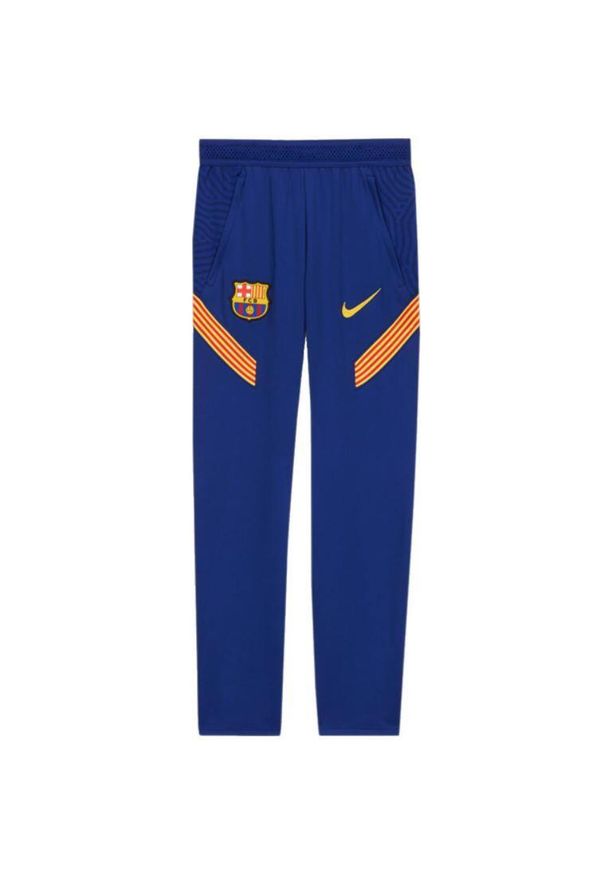 Spodnie Nike FC Barcelona Junior Dri‑FIT Strike – Slim Fit, szaro‑niebieskie. Kolor: niebieski, wielokolorowy, żółty. Materiał: dresówka. Technologia: Dri-Fit (Nike). Sport: piłka nożna