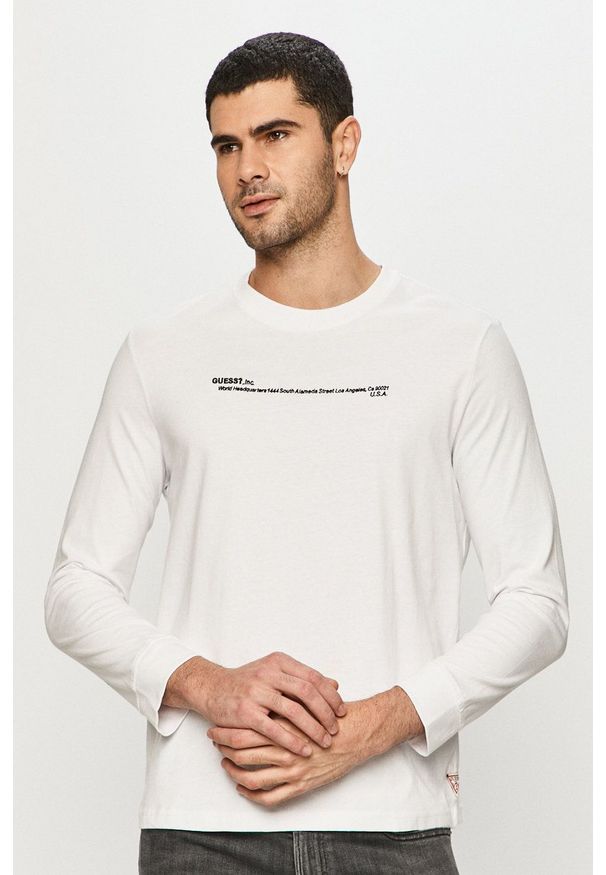 Guess - Longsleeve. Kolor: biały. Materiał: dzianina. Długość rękawa: długi rękaw. Wzór: aplikacja