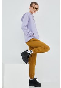 Fila spodnie dresowe damskie kolor brązowy joggery high waist. Stan: podwyższony. Kolor: brązowy. Materiał: dresówka