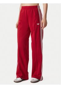 Adidas - adidas Spodnie dresowe Firebird Loose Tracksuit KS4670 Czerwony Loose Fit. Kolor: czerwony. Materiał: syntetyk #1