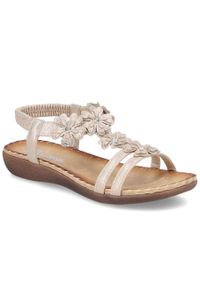 Sandały damskie wsuwane z kwiatami złote Rieker V7573-90. Zapięcie: bez zapięcia. Kolor: złoty. Materiał: skóra ekologiczna. Wzór: kwiaty #1