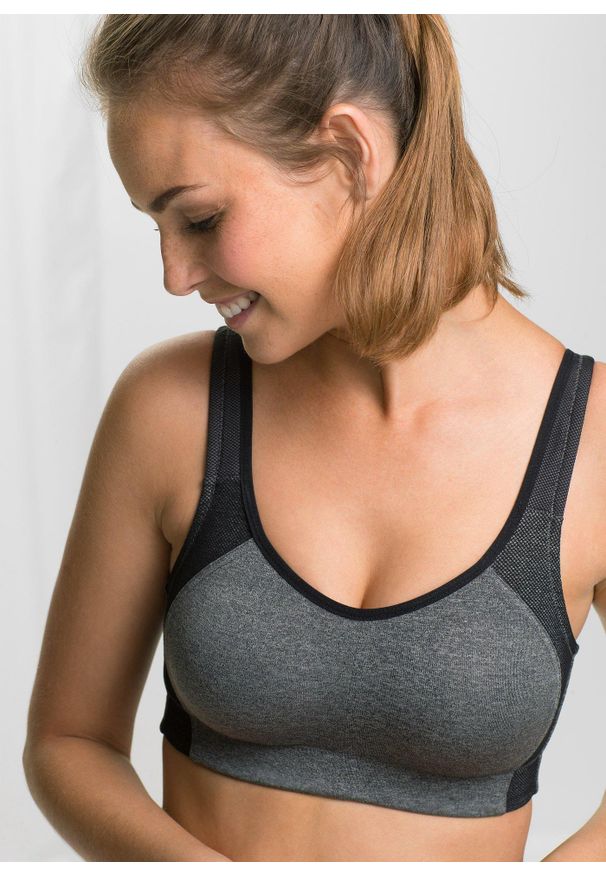 bonprix - Biustonosz sportowy, średni stopień podtrzymywania biustu. Kolor: czarny. Rodzaj stanika: wyściełane miseczki, różne sposoby noszenia