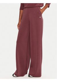 Guess Spodnie dresowe V4YB07 KCAY2 Bordowy Relaxed Fit. Kolor: czerwony. Materiał: syntetyk