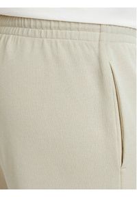 EA7 Emporio Armani Spodnie dresowe 7M002235 AF21822 U1079 Beżowy jasny Regular Fit. Kolor: beżowy. Materiał: bawełna #2