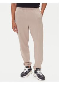 On Spodnie dresowe Club Pants 1ME1004 Beżowy Relaxed Fit. Kolor: beżowy. Materiał: bawełna