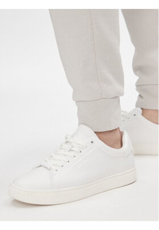 Calvin Klein Spodnie dresowe Metallic Micro Logo Jogger K20K206965 Beżowy Regular Fit. Kolor: beżowy. Materiał: syntetyk, bawełna