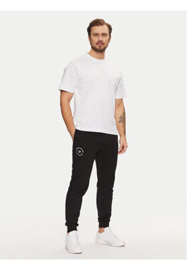 Jack & Jones - Jack&Jones Spodnie dresowe Gordon 12268442 Czarny Regular Fit. Kolor: czarny. Materiał: bawełna, syntetyk