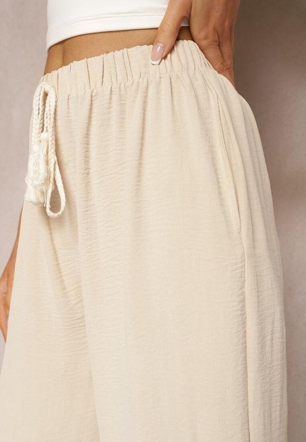 Renee - Beżowe Szerokie Spodnie High Waist z Gumką w Pasie Jolfea. Okazja: na co dzień. Stan: podwyższony. Kolor: beżowy. Materiał: tkanina. Styl: elegancki, casual