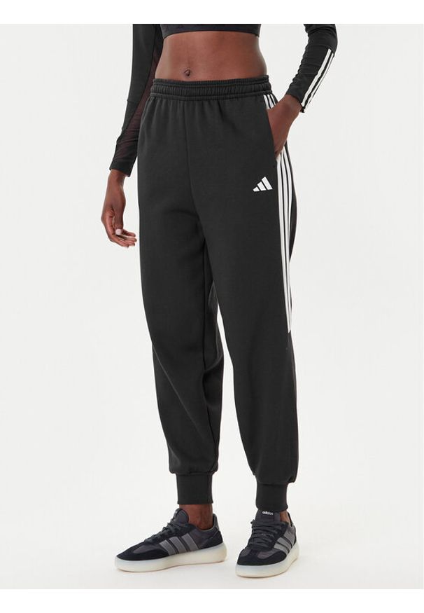 Adidas - adidas Spodnie dresowe Tiro 3-Stripes JL7488 Czarny Loose Fit. Kolor: czarny. Materiał: syntetyk
