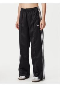 Adidas - adidas Spodnie dresowe Satin Sst KS9372 Czarny Loose Fit. Kolor: czarny. Materiał: syntetyk #1