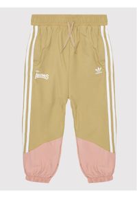 Adidas - adidas Spodnie dresowe Woven HC4541 Beżowy Loose Fit. Kolor: beżowy. Materiał: syntetyk #1