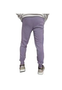 Puma - Spodnie Do Joggingu Męskie Logo ESS+. Kolor: fioletowy. Materiał: dresówka. Sport: bieganie