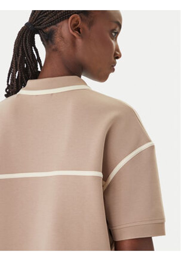 Guess Polo V6GP01 K2945 Beżowy Oversize. Typ kołnierza: polo. Kolor: beżowy. Materiał: syntetyk