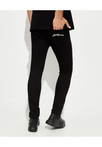 Alexander McQueen - ALEXANDER MCQUEEN - Czarne jeansy z logo. Kolor: czarny #2