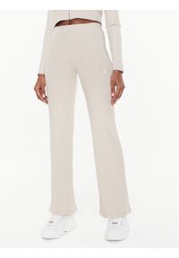 Calvin Klein Jeans Spodnie materiałowe J20J220678 Beżowy Flare Fit. Kolor: beżowy. Materiał: wiskoza, materiał