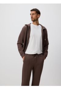 Reserved - Spodnie dresowe slim fit - beżowy. Kolor: beżowy. Materiał: dresówka