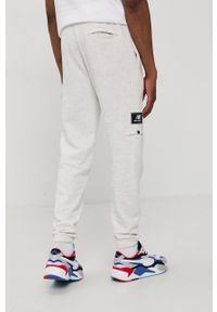 New Balance Spodnie MP13503SAH męskie kolor szary gładkie. Kolor: szary. Materiał: dzianina. Wzór: gładki #4