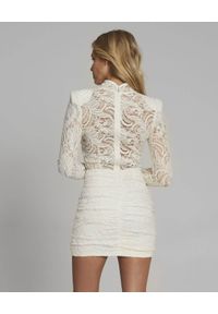 SELF LOVE - Kremowa koronkowa sukienka z kaszmiru PARIS. Kolor: biały. Materiał: kaszmir, koronka. Długość rękawa: długi rękaw. Typ sukienki: dopasowane. Długość: mini