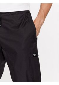 Reebok Spodnie dresowe Essentials II0695 Czarny Regular Fit. Kolor: czarny. Materiał: bawełna #3