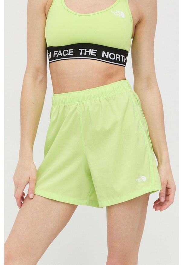 The North Face szorty sportowe Freedom damskie kolor zielony gładkie high waist. Stan: podwyższony. Kolor: zielony. Materiał: materiał. Wzór: gładki. Styl: sportowy