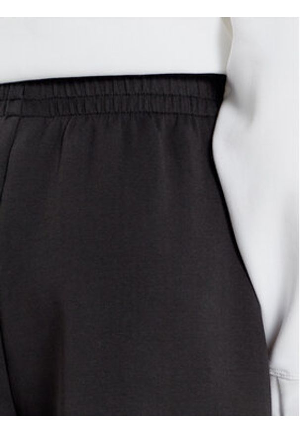 Lacoste Spodnie dresowe XF7374 Czarny Wide Leg. Kolor: czarny. Materiał: bawełna