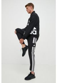 adidas Performance spodnie męskie kolor czarny gładkie. Kolor: czarny. Materiał: tkanina, poliester, skóra, materiał. Wzór: gładki. Sport: fitness #5