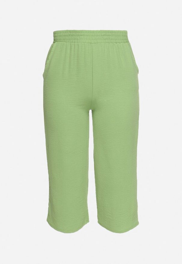 Born2be - Jasnozielone Szerokie Spodnie z Wysokim Stanem z Gumką w Talii i Nogawkami Długości 3/4 Levolia. Okazja: na co dzień. Stan: podwyższony. Kolekcja: plus size. Kolor: zielony. Materiał: jedwab. Styl: casual, elegancki