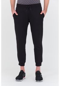 Guess - GUESS Czarne spodnie dresowe Aldwin. Kolor: czarny. Materiał: dresówka #1