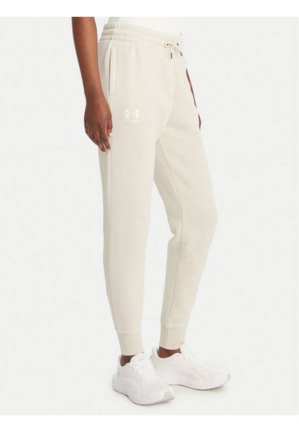 Under Armour Spodnie dresowe UA Icon Fleece 6001537 Beżowy Slim Fit. Kolor: beżowy. Materiał: bawełna