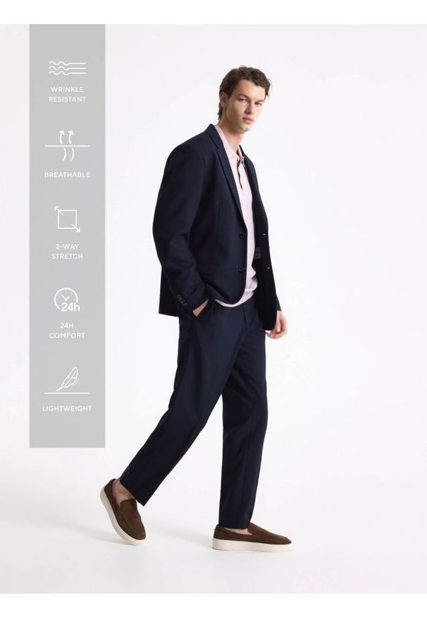 Reserved - Spodnie garniturowe slim fit - granatowy. Kolor: niebieski. Materiał: tkanina, elastan, wiskoza