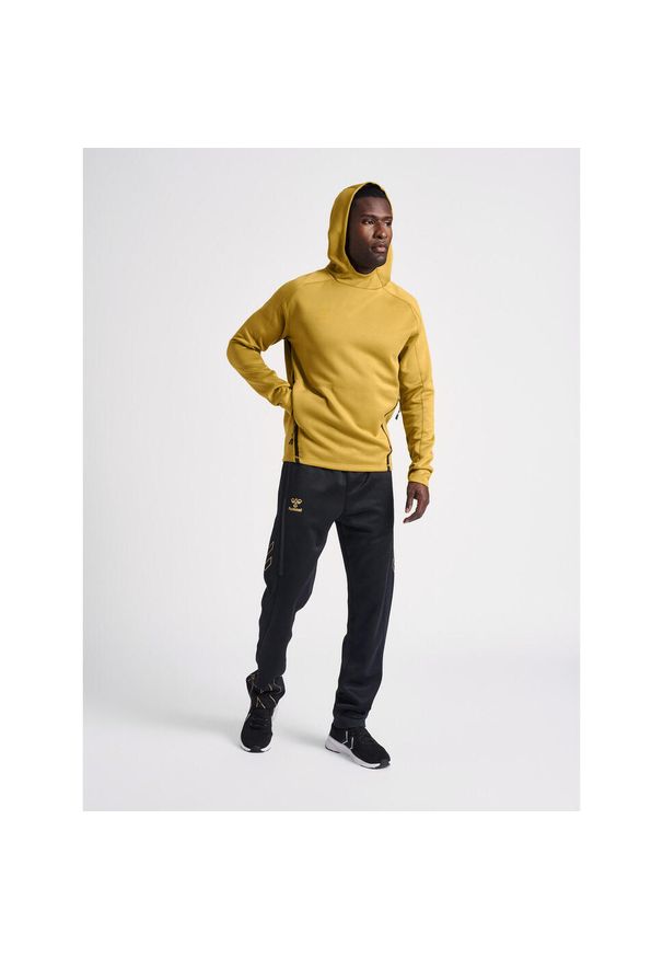 Bluza z kapturem Hummel Cima XK. Typ kołnierza: kaptur. Kolor: żółty, wielokolorowy, beżowy. Materiał: materiał. Wzór: nadruk. Sezon: zima