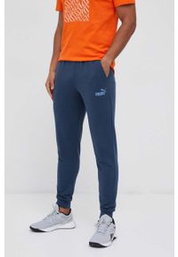 Puma spodnie dresowe kolor granatowy gładkie. Kolor: niebieski. Materiał: dresówka. Wzór: gładki #1