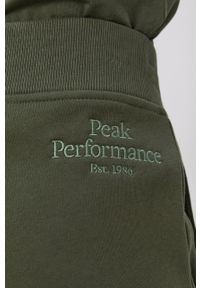 Peak Performance Spodnie damskie kolor zielony gładkie. Kolor: zielony. Materiał: dzianina, bawełna. Wzór: gładki