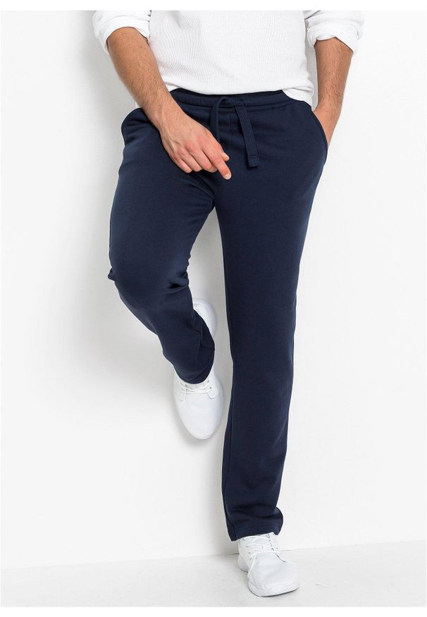 bonprix - Spodnie sportowe z miękką warstwą spodnią i równym dołem. Okazja: na co dzień. Kolor: niebieski. Materiał: dzianina, dresówka. Styl: sportowy