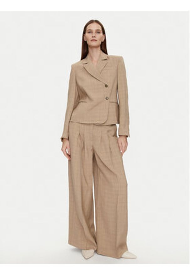Herskind Spodnie materiałowe Lotus 5114110 Beżowy Relaxed Fit. Kolor: beżowy. Materiał: syntetyk