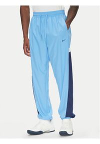 Nike Spodnie dresowe Icon FZ0250 Niebieski Relaxed Fit. Kolor: niebieski. Materiał: syntetyk