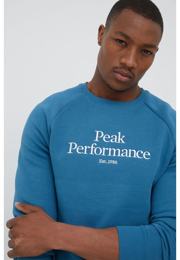 Peak Performance bluza męska z nadrukiem. Okazja: na co dzień. Kolor: niebieski. Materiał: bawełna. Długość rękawa: raglanowy rękaw. Wzór: nadruk. Styl: casual