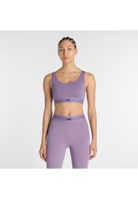 Biustonosz do treningu New Balance AC WB61Q0QKAA5 – fioletowy. Kolor: fioletowy. Materiał: tkanina, poliester, materiał. Rodzaj stanika: wyciągane miseczki, push-up. Sport: fitness #1