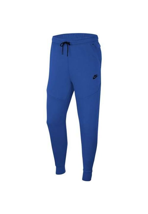 Spodnie sportowe męskie Nike Tech Fleece. Kolor: niebieski. Materiał: dresówka. Sport: turystyka piesza