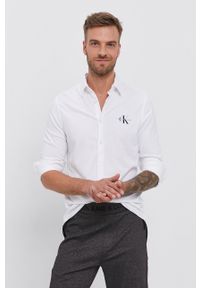 Calvin Klein Jeans - Koszula bawełniana. Okazja: na co dzień. Typ kołnierza: kołnierzyk klasyczny. Kolor: biały. Materiał: bawełna. Długość rękawa: długi rękaw. Długość: długie. Styl: casual, klasyczny #3