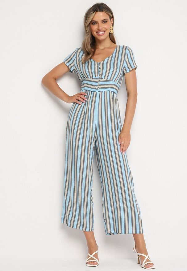 Born2be - Niebieski Wiskozowy Kombinezon z Guzikami przy Dekolcie i Elastyczną Gumką w Talii Tinaleias. Okazja: do pracy, na co dzień. Kolor: niebieski. Materiał: wiskoza. Długość: długie. Wzór: aplikacja. Styl: casual, klasyczny