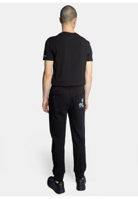 Spodnie dresowe męskie czarne Armani Exchange 8NZPSC ZJKRZ 1200. Kolor: czarny. Materiał: dresówka. Sport: turystyka piesza